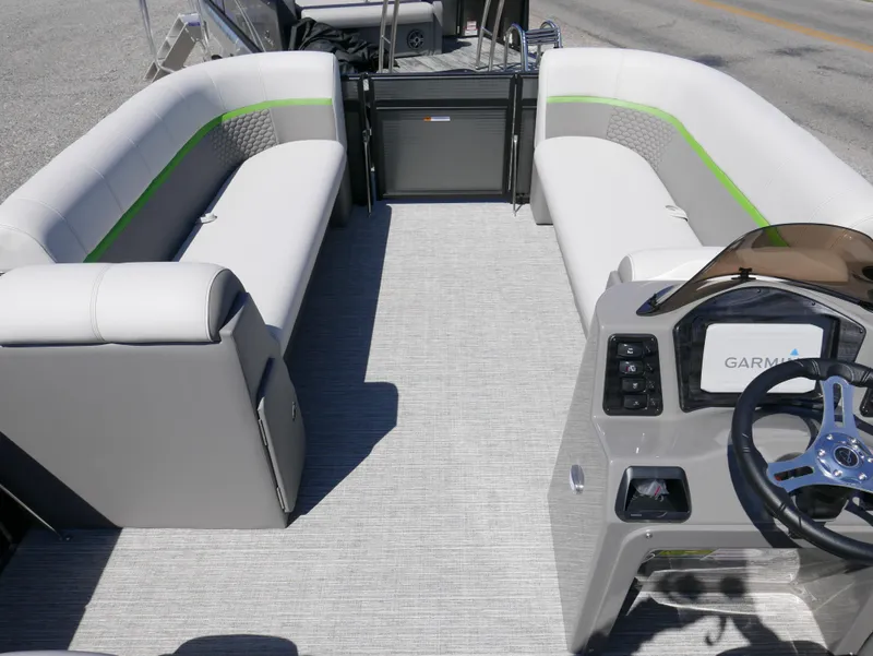 Slide: The Image of 2023 Qwest E-Class 822 RLS LTZ pontoon boat interior with plush seating and modern helm. - 5