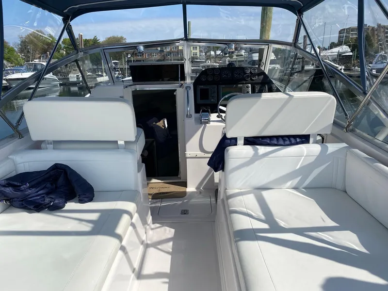 Slide: The Image of 1995 Blackfin 29-2 Combi boat interior with white seating and control panel. - 11