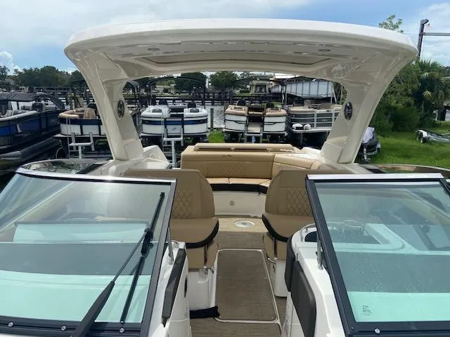 Slide: The Image of 2021 Sea Ray 310 SLX boat with spacious seating and modern design. - 12