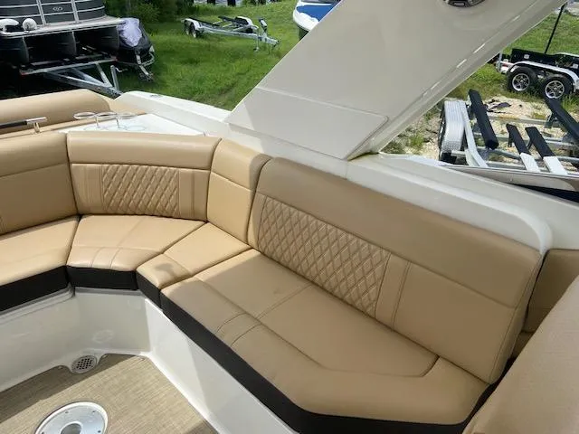 Slide: The Image of Luxurious seating area on a 2021 Sea Ray 310 SLX boat with tan upholstery. - 20