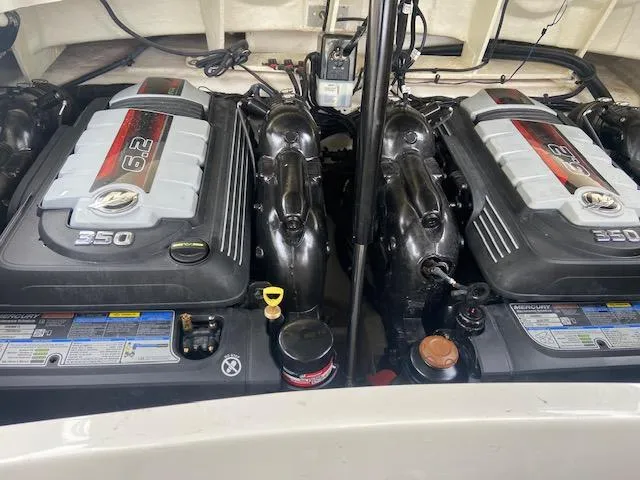 Slide: The Image of Twin engines of a 2021 Sea Ray 310 SLX boat. - 22