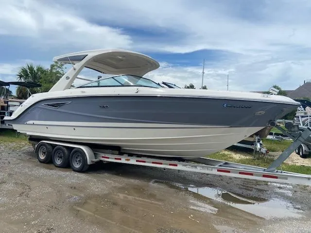 Slide: The Image of 2021 Sea Ray 310 SLX boat on a triple-axle trailer. - 3