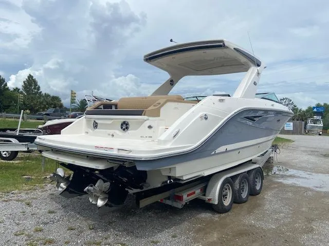Slide: The Image of 2021 Sea Ray 310 SLX boat on a trailer, rear view. - 4