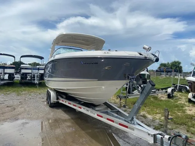 Slide: The Image of 2021 Sea Ray 310 SLX boat on a trailer, ready for transport. - 7