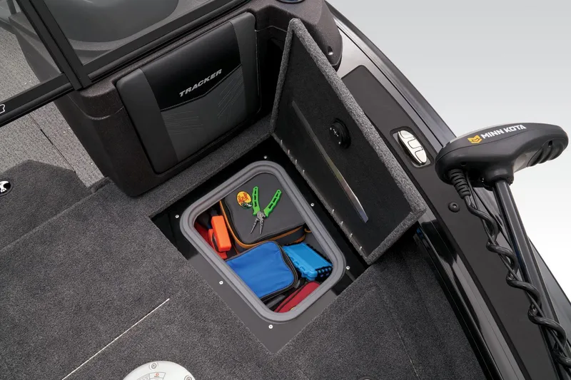 Slide: The Image of 2023 Tracker Targa V-19 WT boat storage compartment with fishing gear. - 12