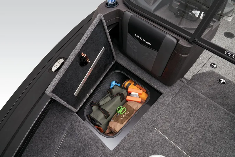 Slide: The Image of 2023 Tracker Targa V-19 WT storage compartment with fishing gear. - 13