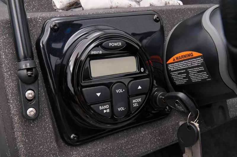 Slide: The Image of Control panel of a 2023 Tracker Targa V-19 WT boat with keys and warning label. - 41