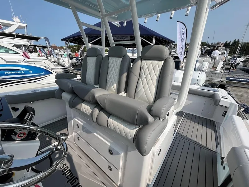 Slide: The Image of Luxury seating on the 2023 Everglades 365 CC boat at a marina. - 11