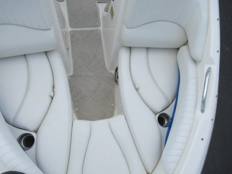 Slide: The Image of 2008 Glastron GXL 185 boat interior with white cushioned seating. - 17
