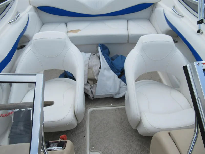 Slide: The Image of 2008 Glastron GXL 185 boat interior with white and blue seating. - 19