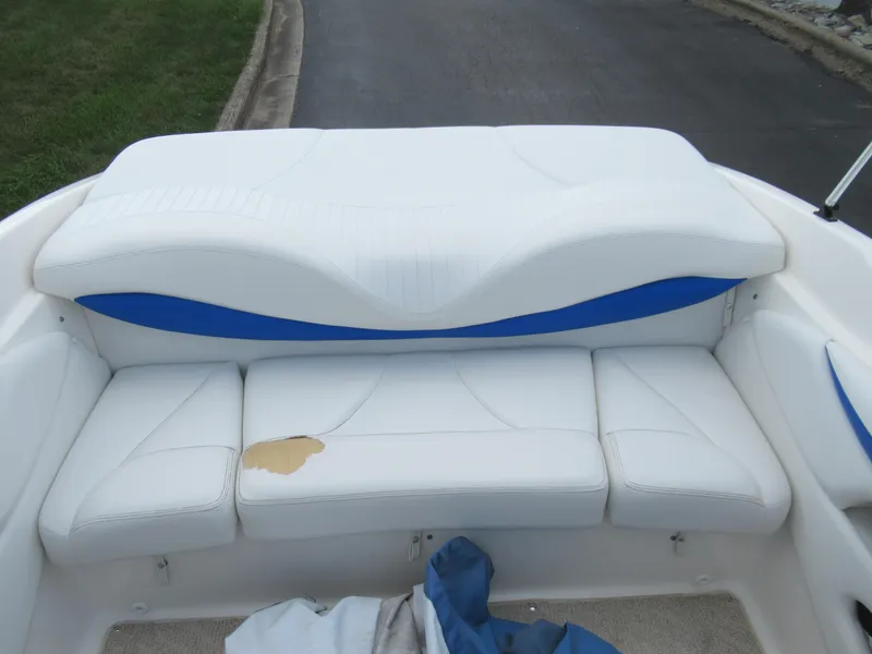 Slide: The Image of 2008 Glastron GXL 185 boat with white and blue seating. - 20