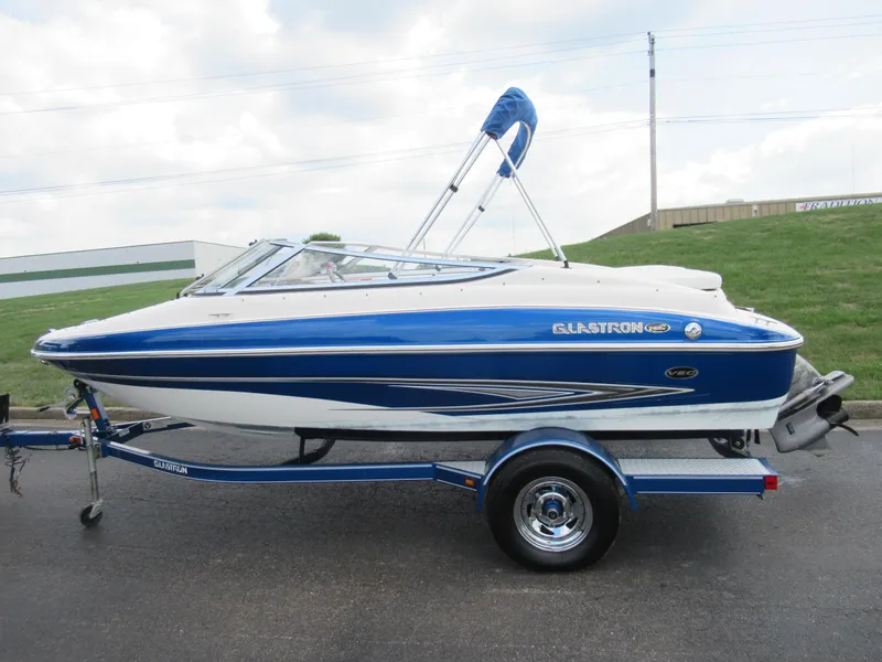 Slide: The Image of 2008 Glastron GXL 185 blue and white speedboat on trailer. - 4