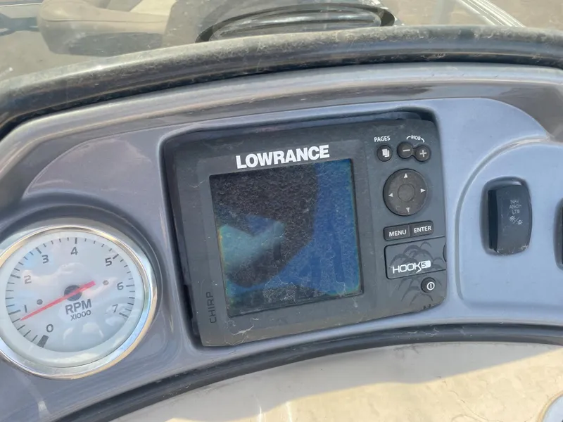 Slide: The Image of Close-up of Lowrance fish finder and RPM gauge on 2016 Sun Tracker Fishin' Barge 22 DLX. - 4