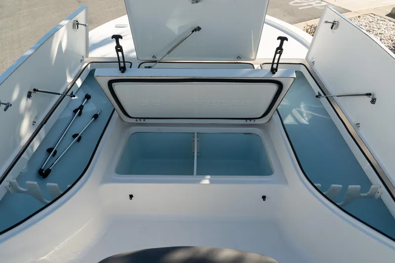 Slide: The Image of 2023 Sea Born FX22 Bay boat storage compartments open, showcasing spacious interior design. - 14