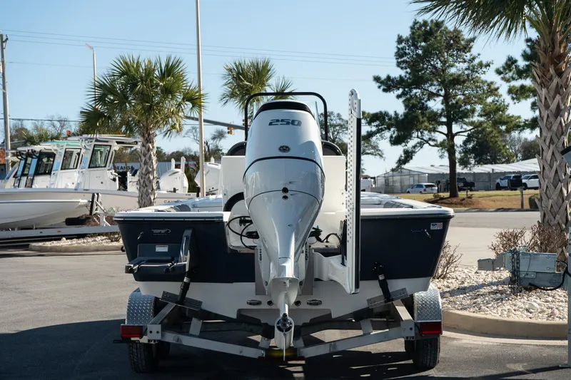 Slide: The Image of 2023 Sea Born FX22 Bay boat on trailer, parked outdoors. - 4