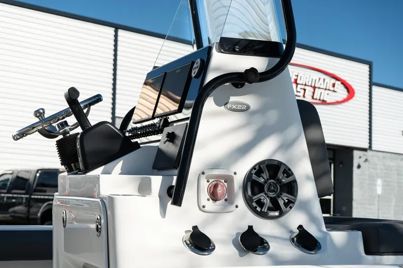 Slide: The Image of 2023 Sea Born FX22 Bay boat console with steering wheel and controls. - 6