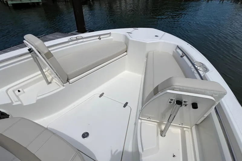 Slide: The Image of 2024 Boston Whaler 280 Dauntless boat interior with cushioned seating and sleek design. - 8