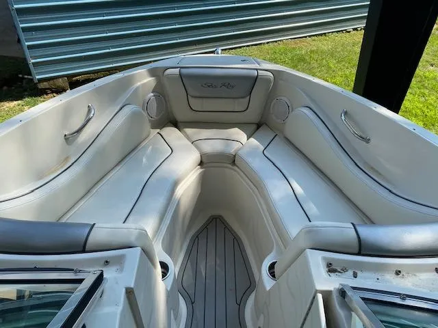 Slide: The Image of 2010 Sea Ray 230 Select boat interior with white cushioned seating. - 10