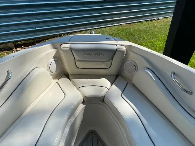Slide: The Image of 2010 Sea Ray 230 Select boat interior with white cushioned seating. - 12