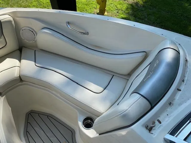 Slide: The Image of Interior seating of a 2010 Sea Ray 230 Select boat with white upholstery. - 13