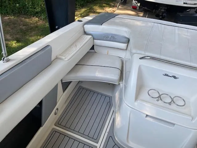 Slide: The Image of 2010 Sea Ray 230 Select boat interior with seating and storage compartments. - 19