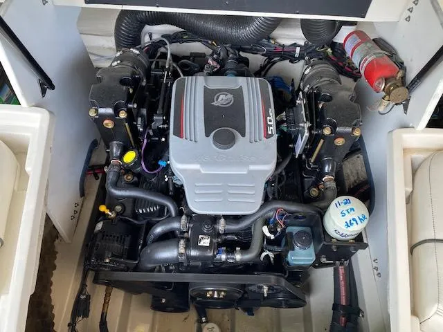 Slide: The Image of Engine compartment of a 2010 Sea Ray 230 Select boat. - 24