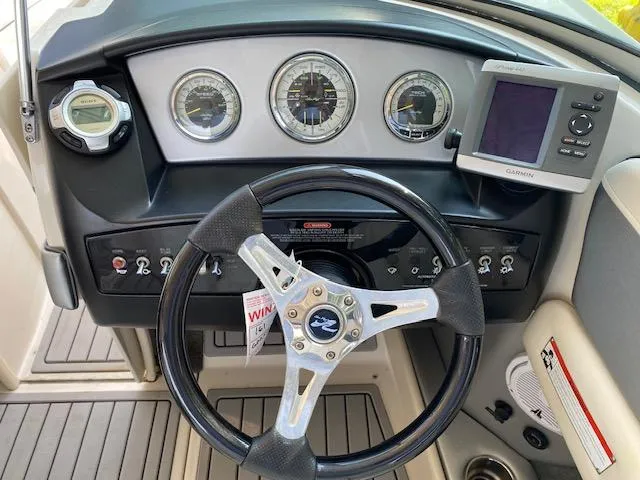 Slide: The Image of Steering console of a 2010 Sea Ray 230 Select boat with Garmin GPS. - 8