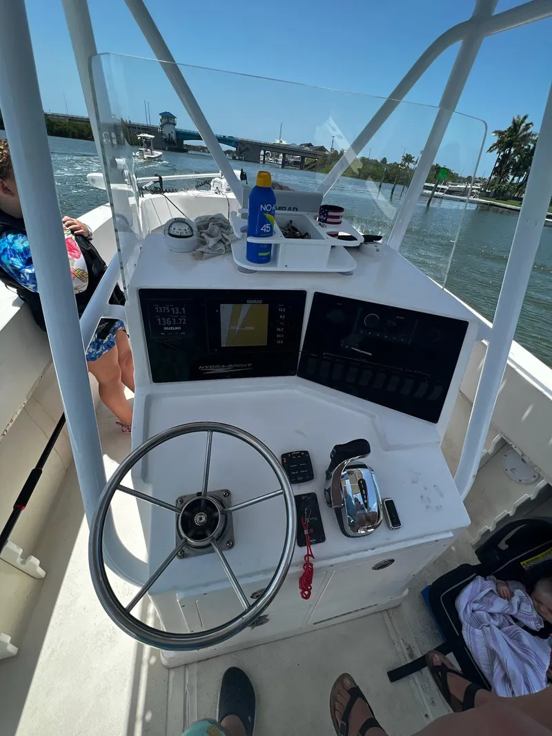 Slide: The Image of 1988 Hydra-Sports 2500 CC boat console with steering wheel and navigation equipment. - 10