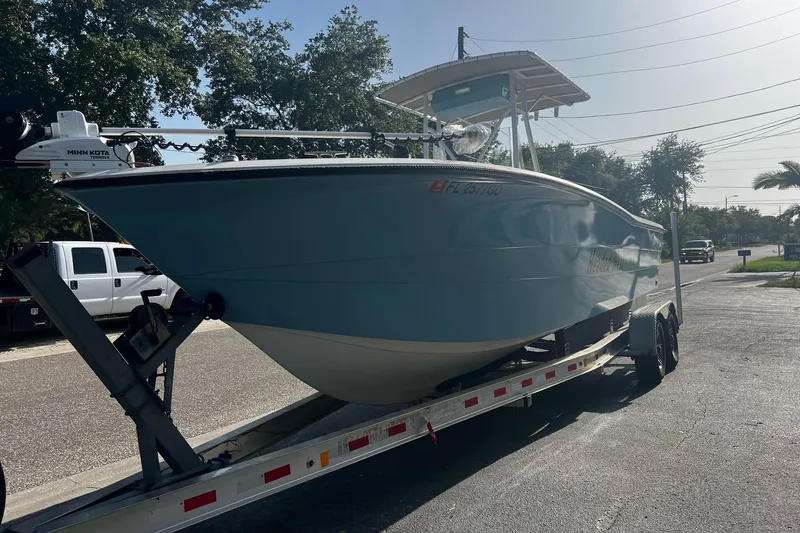 Slide: The Image of 1988 Hydra-Sports 2500 CC boat on a trailer in a parking lot. - 17