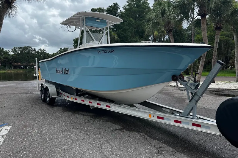 Slide: The Image of 1988 Hydra-Sports 2500 CC boat on a trailer in a parking lot. - 18