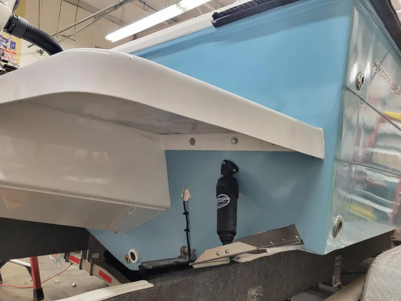 Slide: The Image of 1988 Hydra-Sports 2500 CC boat rear view in a workshop. - 4