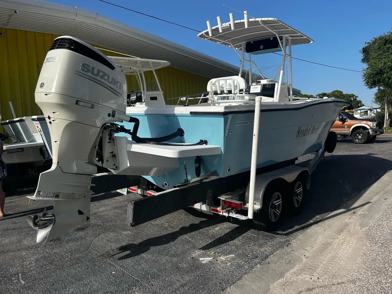 Slide: The Image of 1988 Hydra-Sports 2500 CC boat with Suzuki outboard motor on trailer. - 8