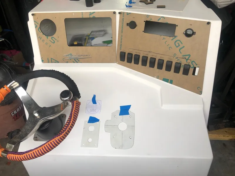 Slide: The Image of 1988 Hydra-Sports 2500 CC boat dashboard with steering wheel and control panel. - 9