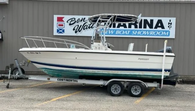The Image of 1995 Pursuit 2150 Center Console boat on a Continental trailer at Ben Watts Marina. - 1