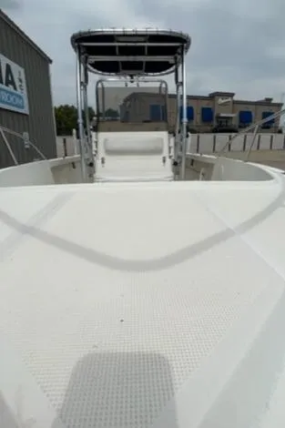 Slide: The Image of 1995 Pursuit 2150 Center Console boat with T-top in marina. - 5