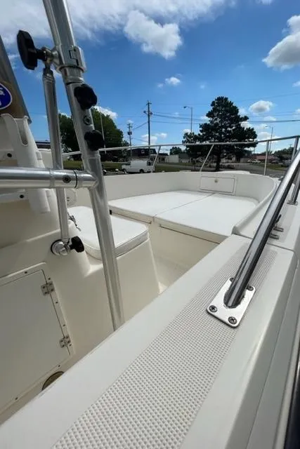 Slide: The Image of 1995 Pursuit 2150 Center Console boat with spacious deck and stainless steel railings. - 7