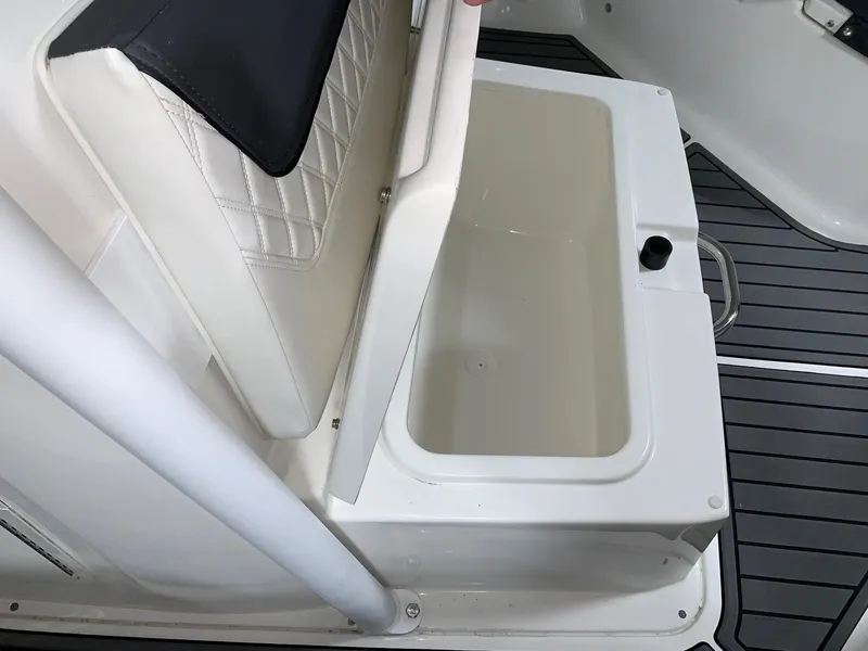 Slide: The Image of Bayliner Trophy 24 CC 2024 model, open storage compartment under seat. - 6