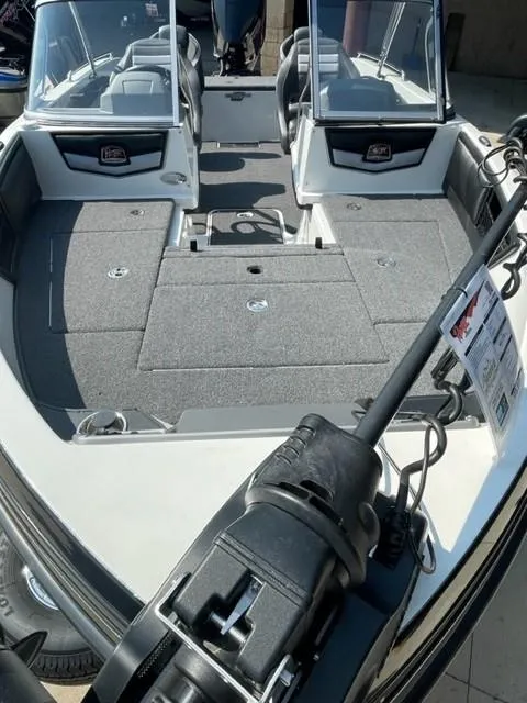 Slide: The Image of 2023 Ranger 1850MS fishing boat interior with dual consoles and ample storage. - 3