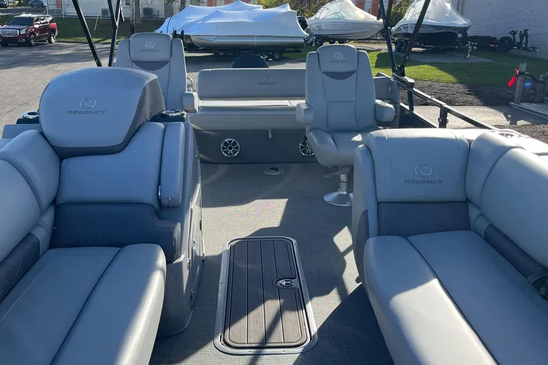 Slide: The Image of 2023 Regency 230 LE3 Sport boat interior with luxurious seating. - 12
