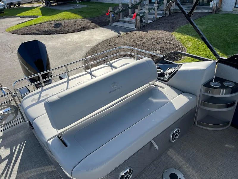 Slide: The Image of 2023 Regency 230 LE3 Sport boat with comfortable seating and modern design. - 4