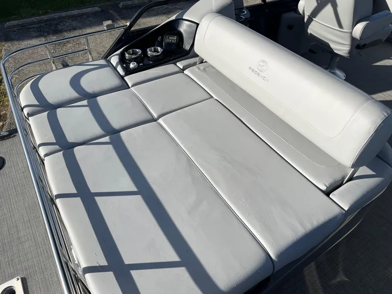 Slide: The Image of 2023 Regency 230 LE3 Sport boat with gray cushioned seating. - 5