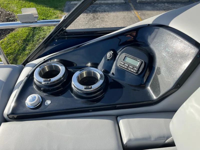Slide: The Image of Control panel of 2023 Regency 230 LE3 Sport boat with cup holders and digital display. - 6