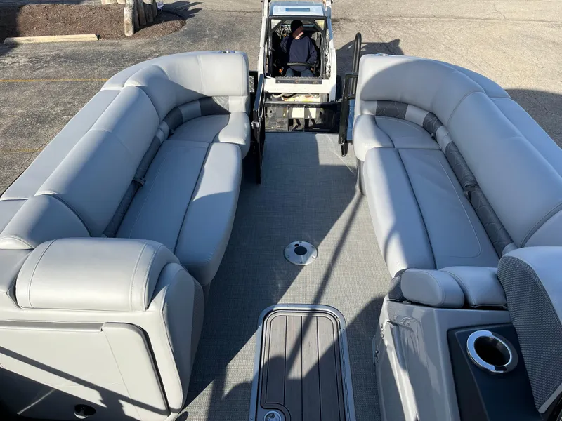Slide: The Image of 2023 Regency 230 LE3 Sport pontoon boat with spacious seating and modern design. - 9