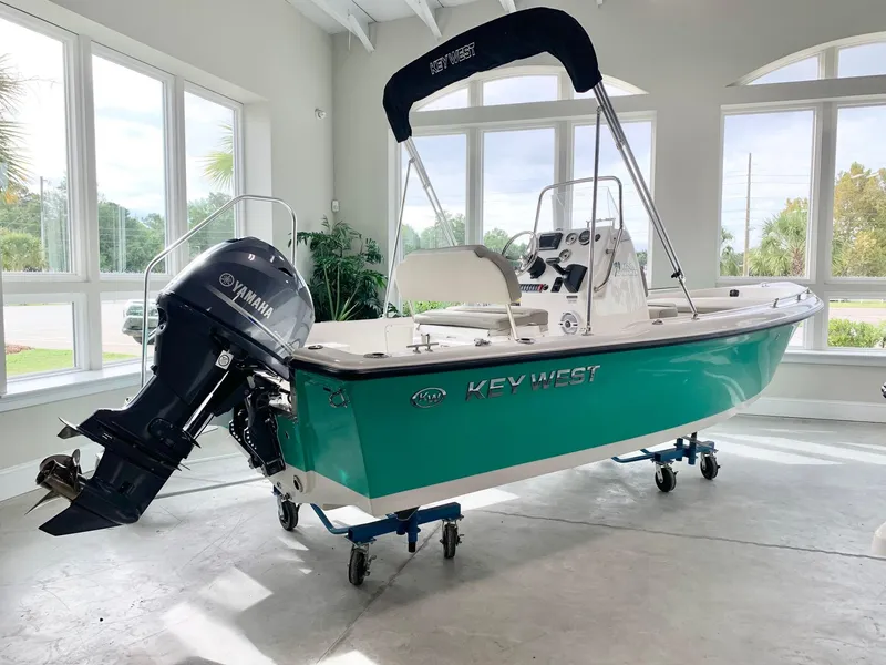 Slide: The Image of 2024 Key West 1720 Sportsman boat with Yamaha outboard motor in showroom. - 0