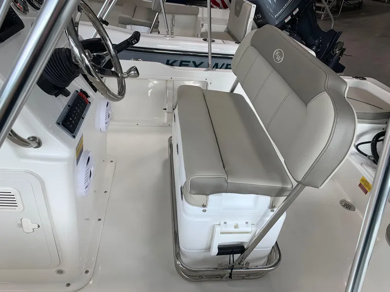 Slide: The Image of 2024 Key West 1720 Sportsman boat interior with steering console and cushioned seating. - 6