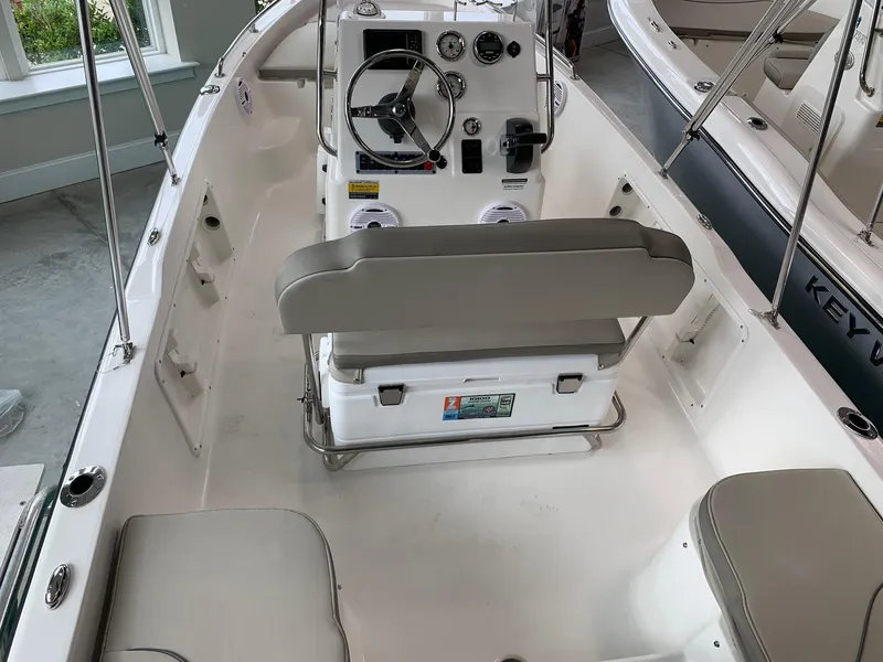 Slide: The Image of 2024 Key West 1720 Sportsman boat interior with steering console and seating. - 8