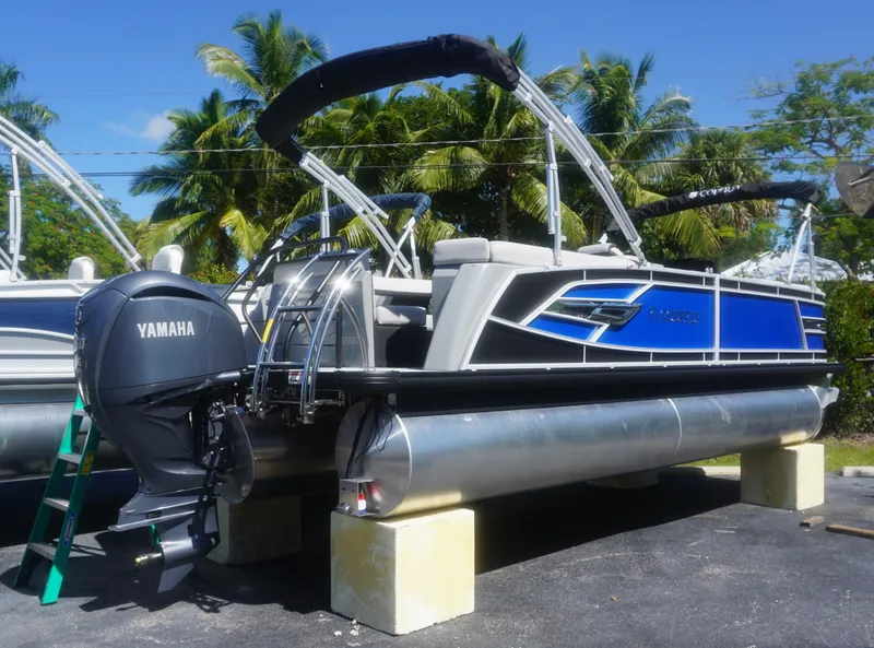 Slide: The Image of 2023 AquaPatio 235 ULC pontoon boat with Yamaha outboard motor on display. - 1