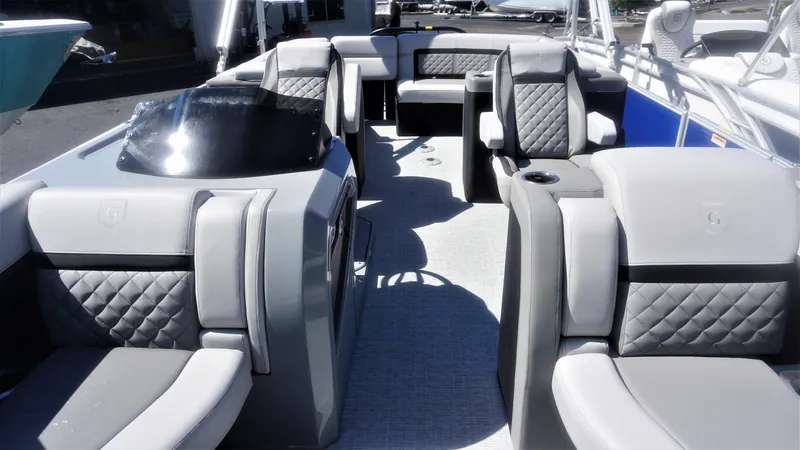 Slide: The Image of 2023 AquaPatio 235 ULC boat interior with luxurious seating and modern design. - 10