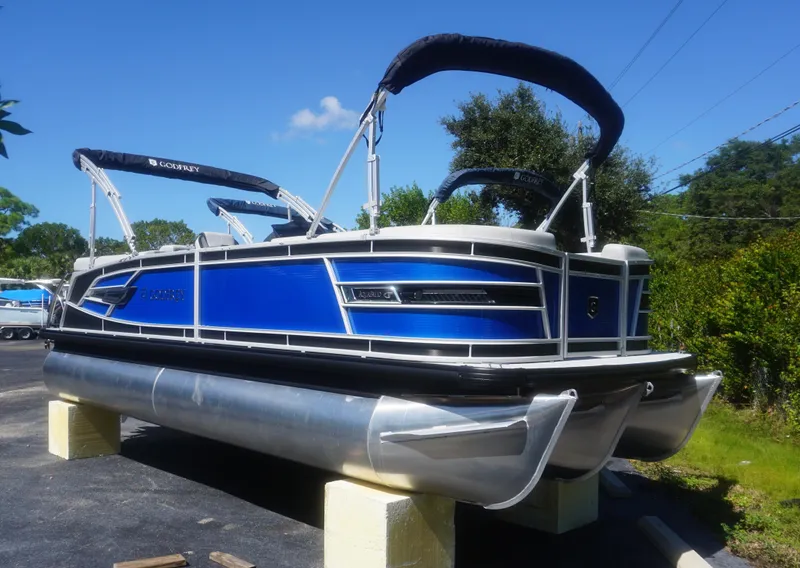 Slide: The Image of 2023 AquaPatio 235 ULC pontoon boat with blue exterior on display. - 25