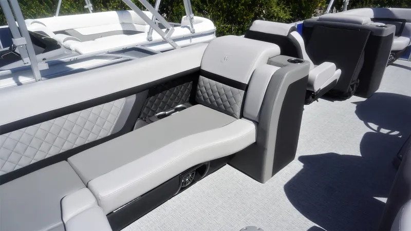Slide: The Image of 2023 AquaPatio 235 ULC boat interior with luxurious seating and modern design. - 8